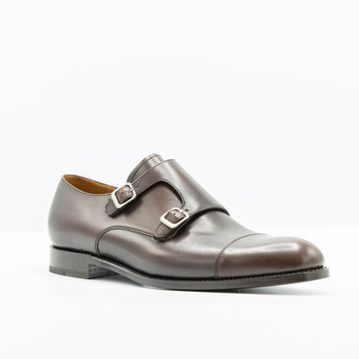 Double monk strap shoes in deep brown leather. Set on leather good year welted soles. Cap toe.
