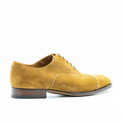 Cognac suede oxford shoes with leather soles that are edgestichted, 