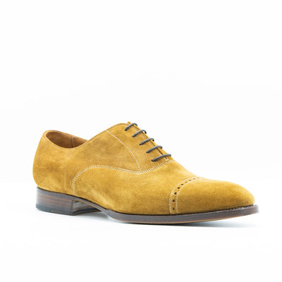 Cognac suede oxford shoes with leather soles that are edgestichted, 