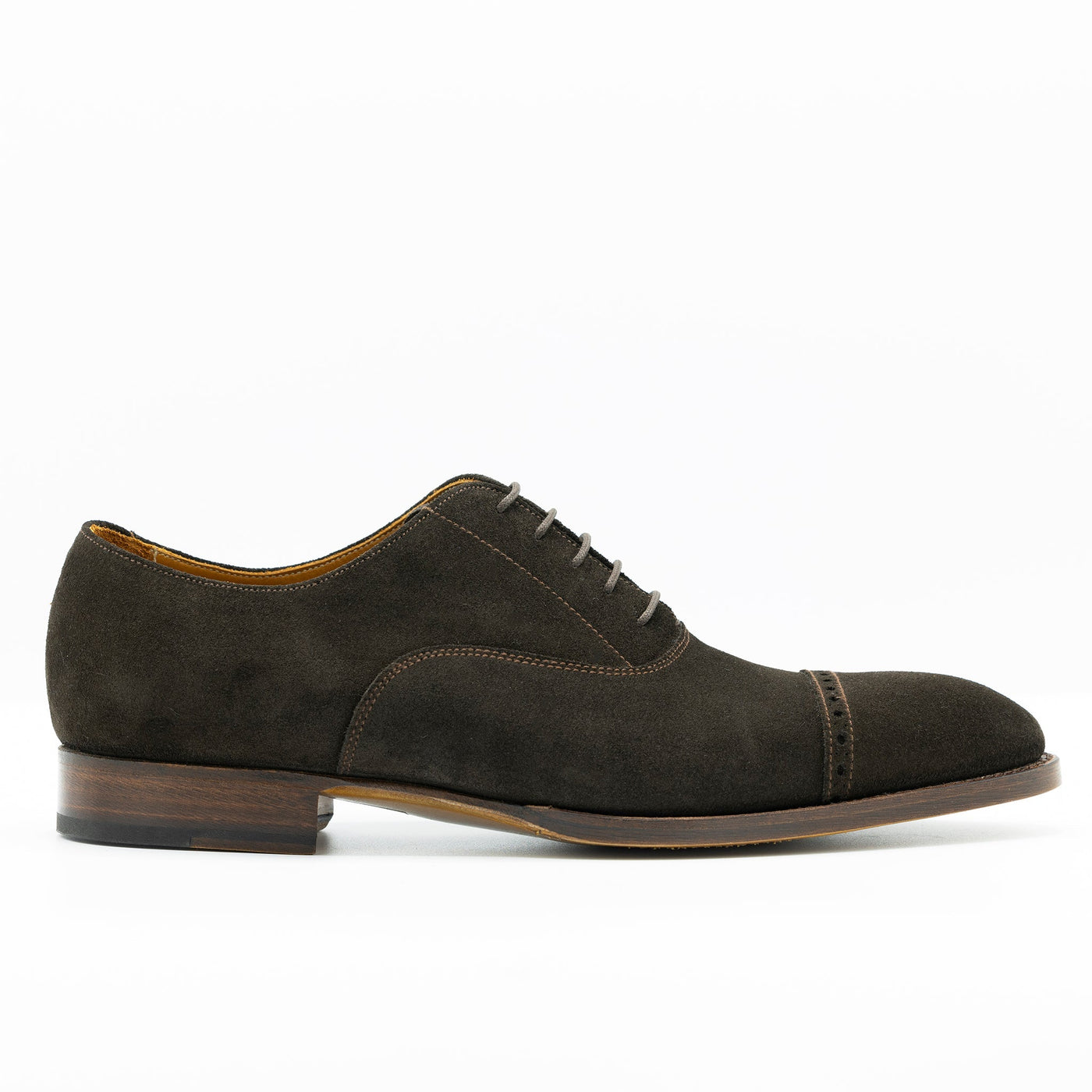 Brown Suede oxford shoes with edgestiched leather soles and waxed shoe laces.Brown Suede oxford shoes with edgestiched leather soles and waxed shoe laces.