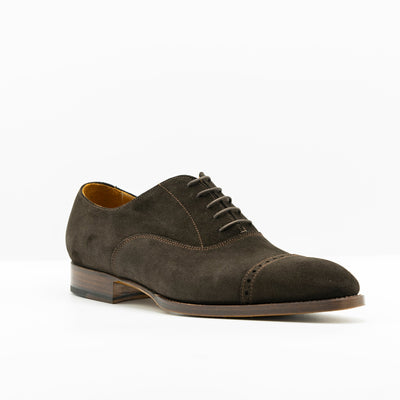 Brown Suede oxford shoes with edgestiched leather soles and waxed shoe laces.