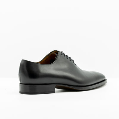 Black Leather oxfords with closed lacing and set on handstiched good year welted soles. 