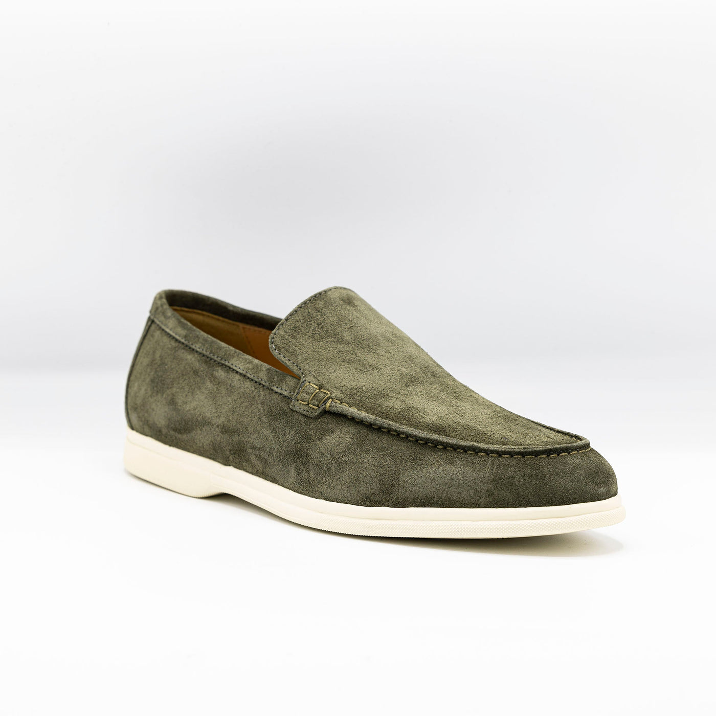 City loafer, Summer walk in khaki suede set on a white rubber sole. 