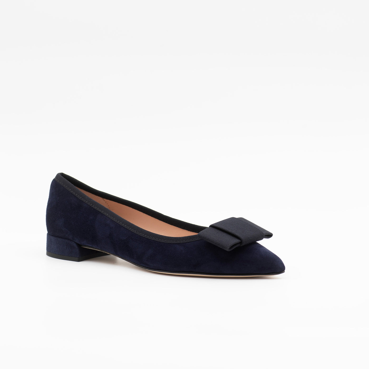 Pointed toe flats in navy with a bow