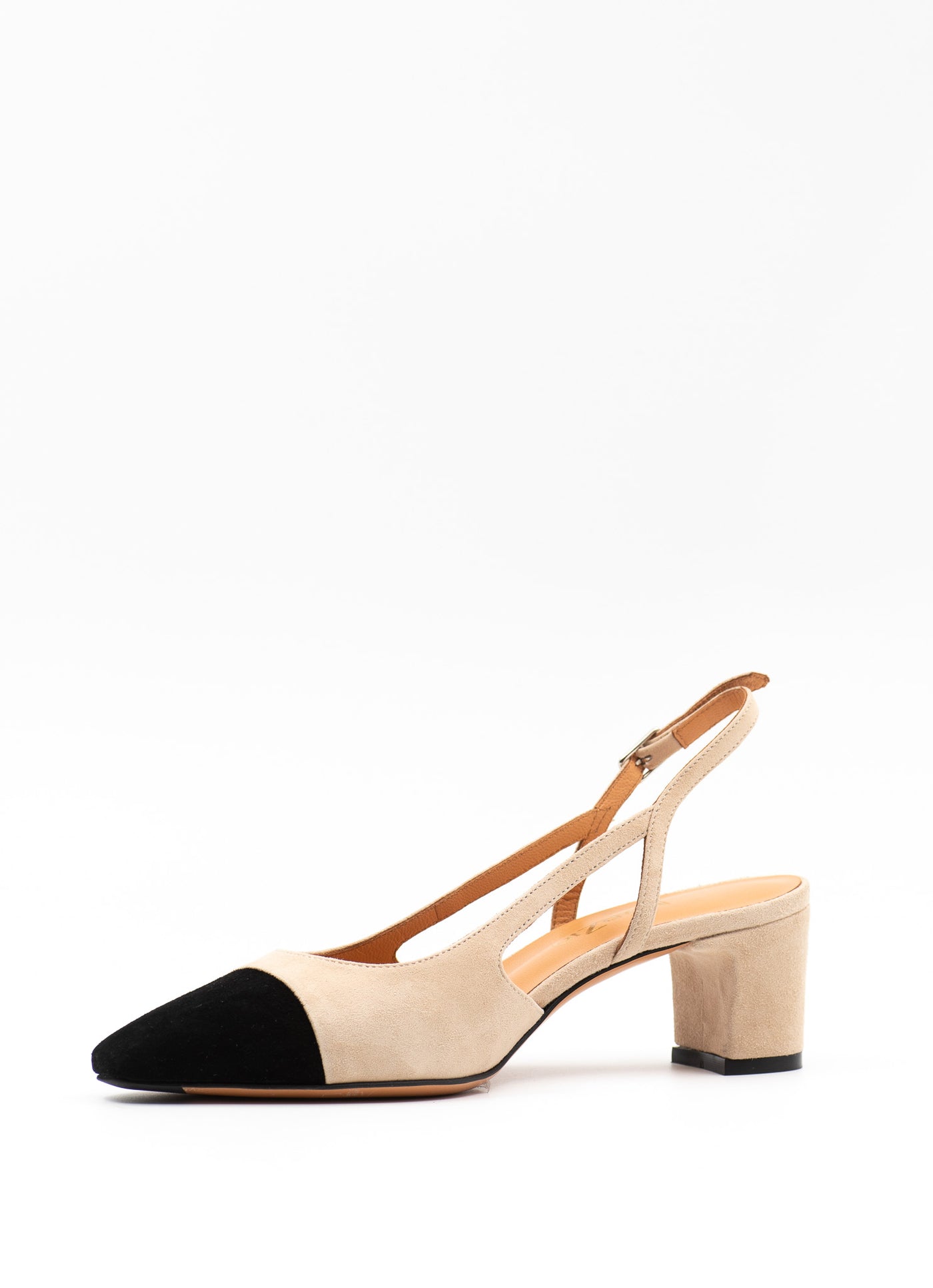 Beige pumps with a contrasting black toe
