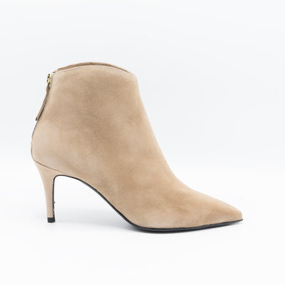 Beige ankle boots with rounded shaft stiletto heel and pointy toe. 