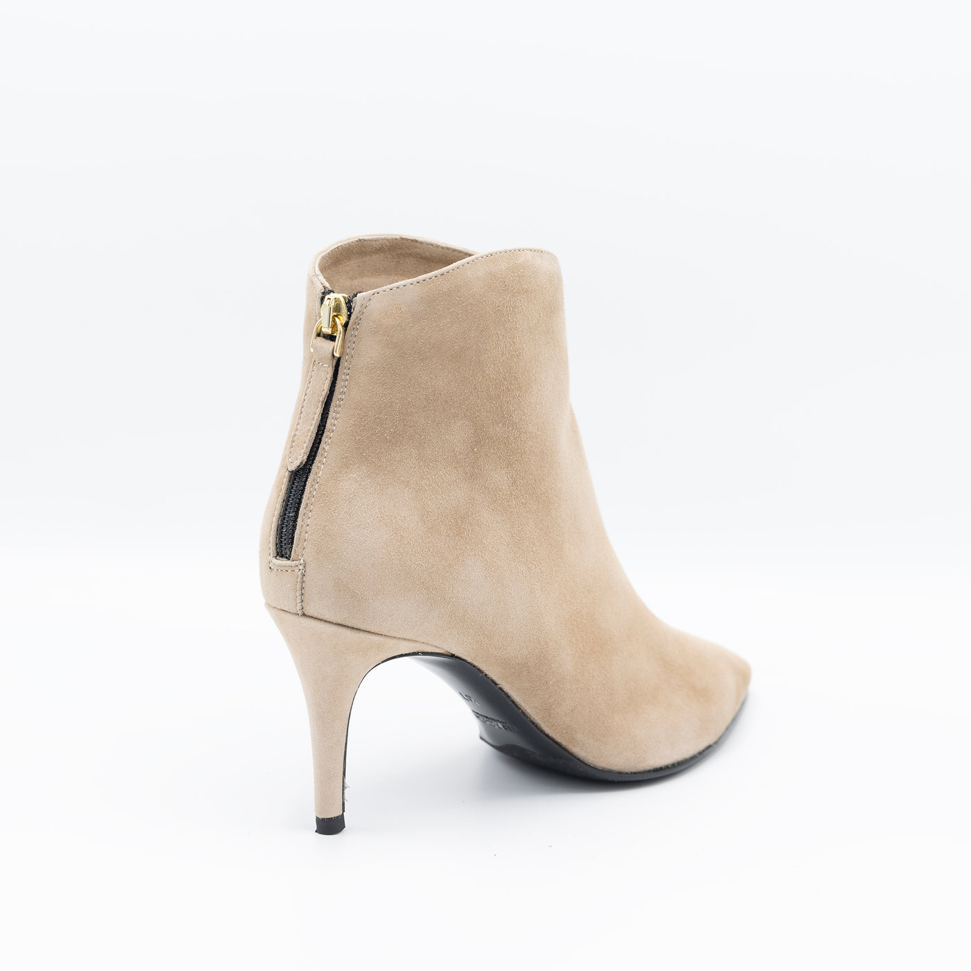 Beige suede ankle boots with rounded saft, pointy heel and stiletto heel. 
