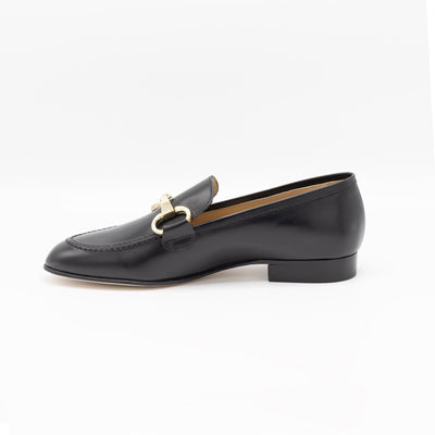 Black leather loafers with horsebit. 