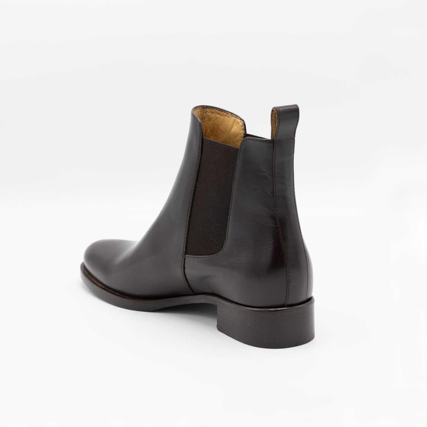Brown leather chelsea boots with elastic panels.