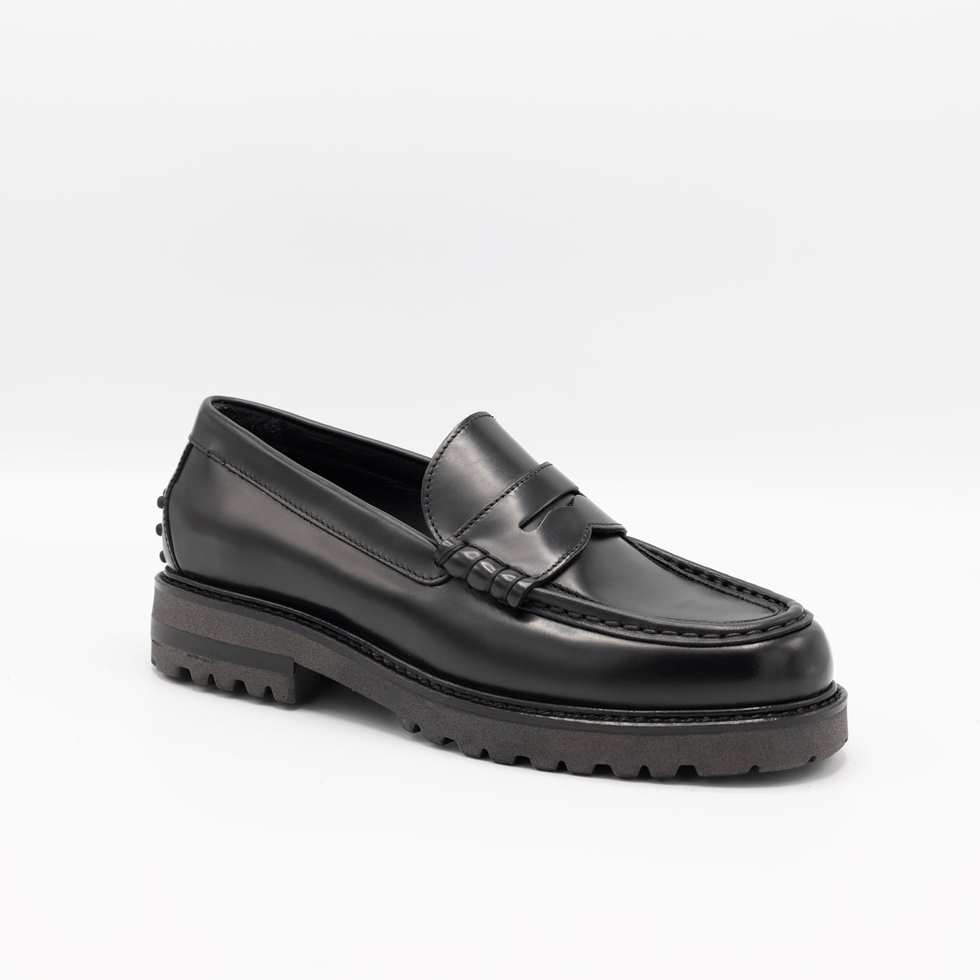 Black chunky leather loafers with sturdy rubber soles. Handmade in Italy