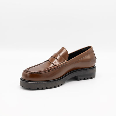 Chunky leather loafer in glossy cognac leather on sturdy rubber soles. 