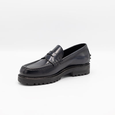 Chunky loafers in glossy dark blue with rubber pebbles on the heel. 