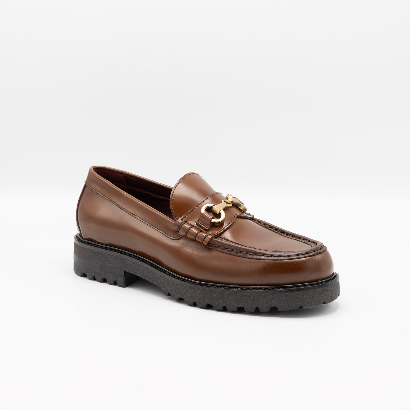 Patent cognac leather loafers with horsebit. 