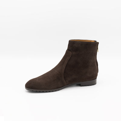 Round toe flat ankle boots in brown suede with zipper on heel. 