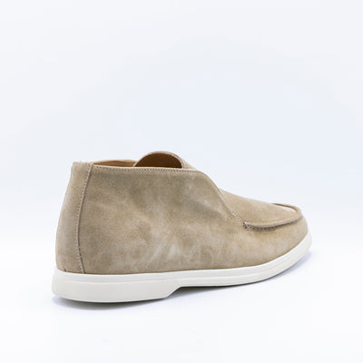 Open walks in beige suede set on white rubber soles. 