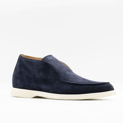 City loafer in navy suede with white rubber soles. 