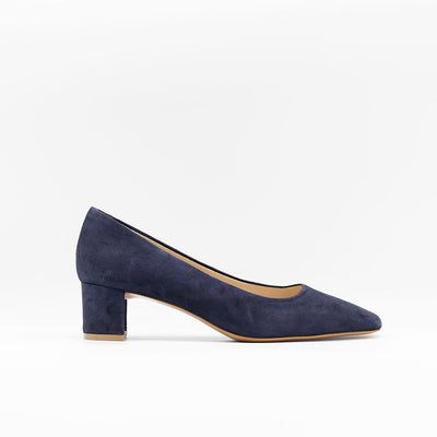 Square toe pumps with mid block heel in navy suede. Set on leather soles. 