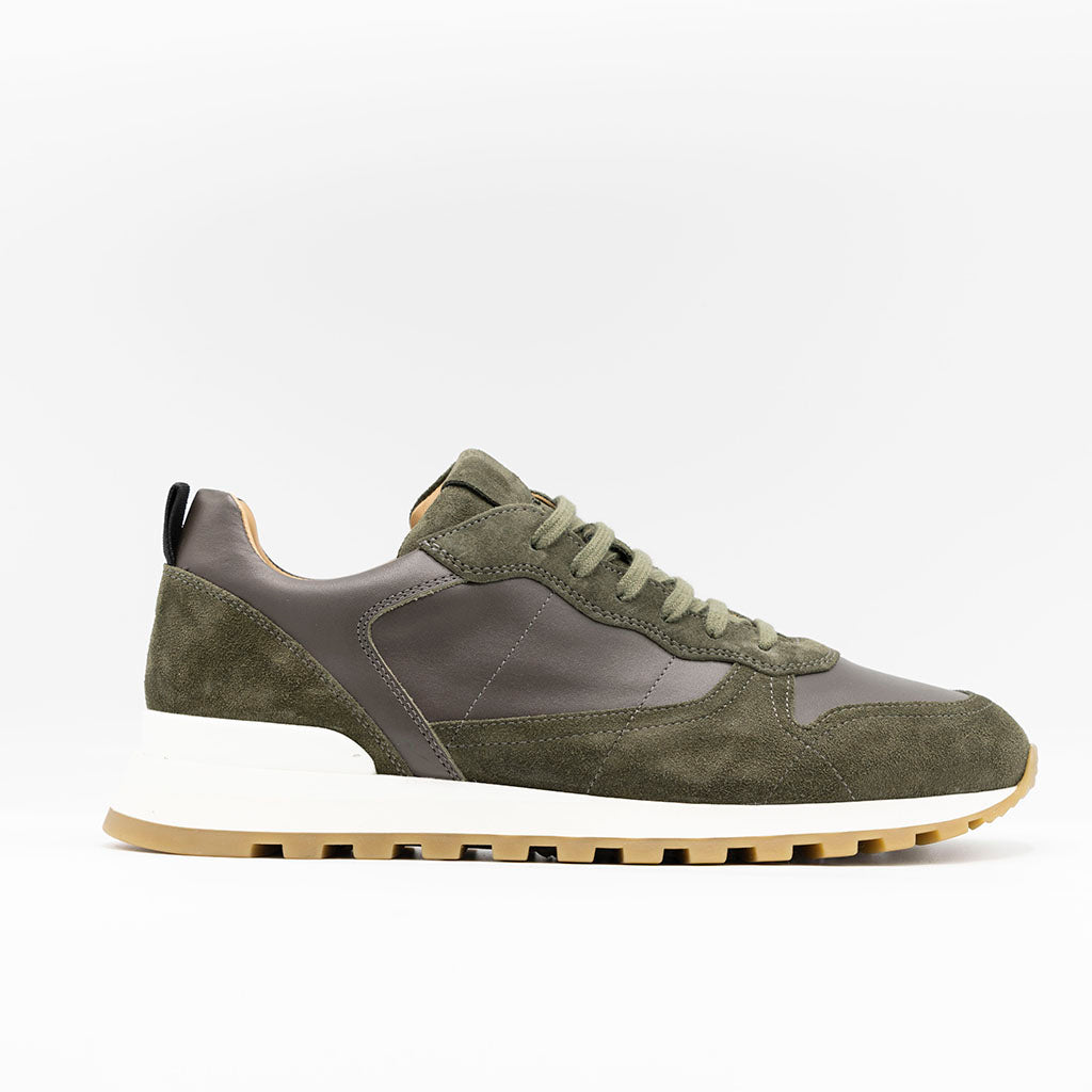 Mens sporty sneaker in khaki suede and leather set on ckunky durable beige and white tubber sole. 