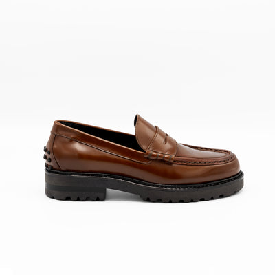 Chunky loafers in cognac leather with rubber pebbles on heel. 