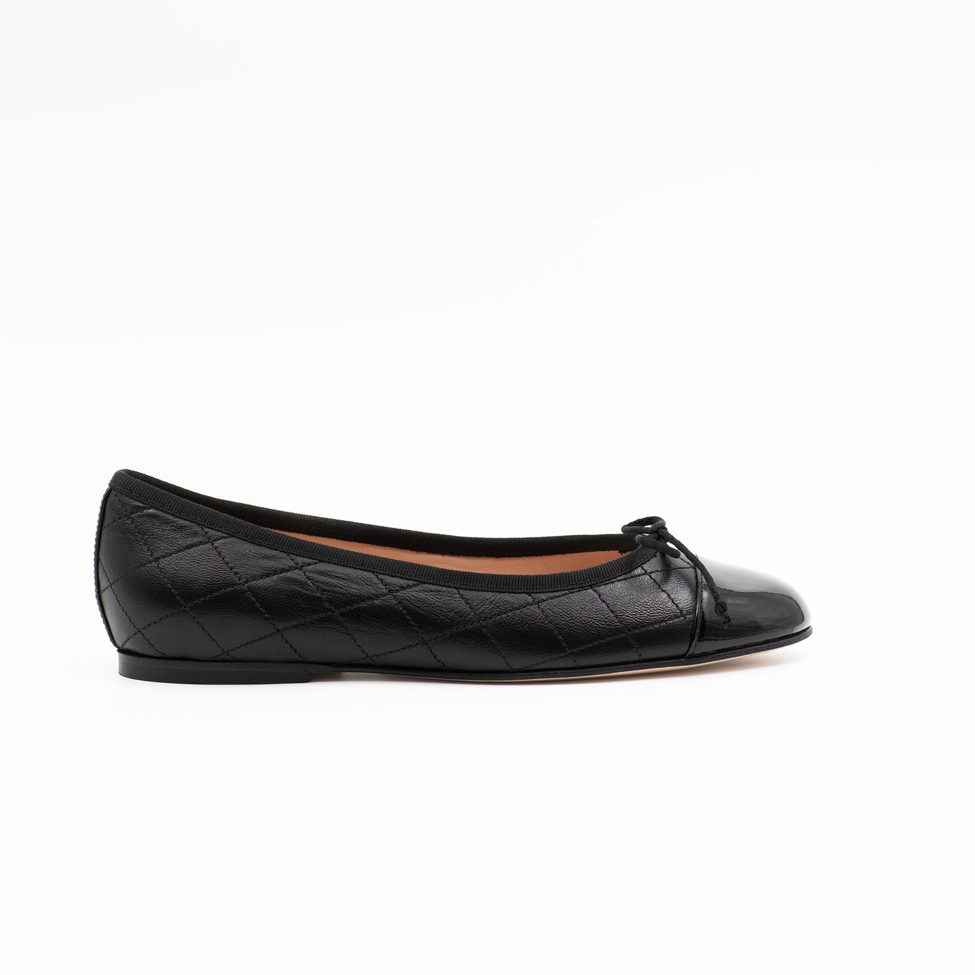 Quilted black ballet flats with patent toe