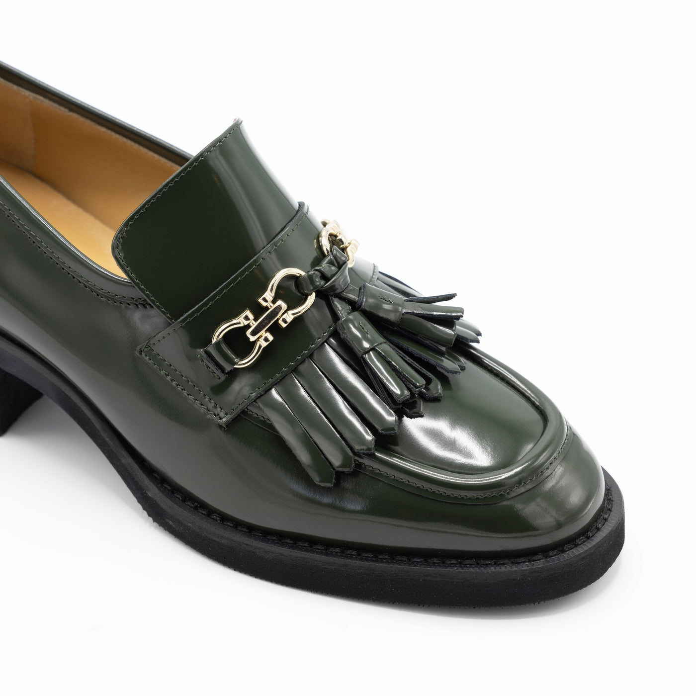 Green loafer pumps with gold tone embellishment