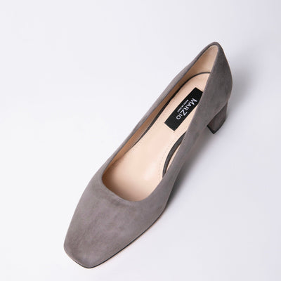 Square toe pump in taupe suede. set on mid block heel with leather soles. 