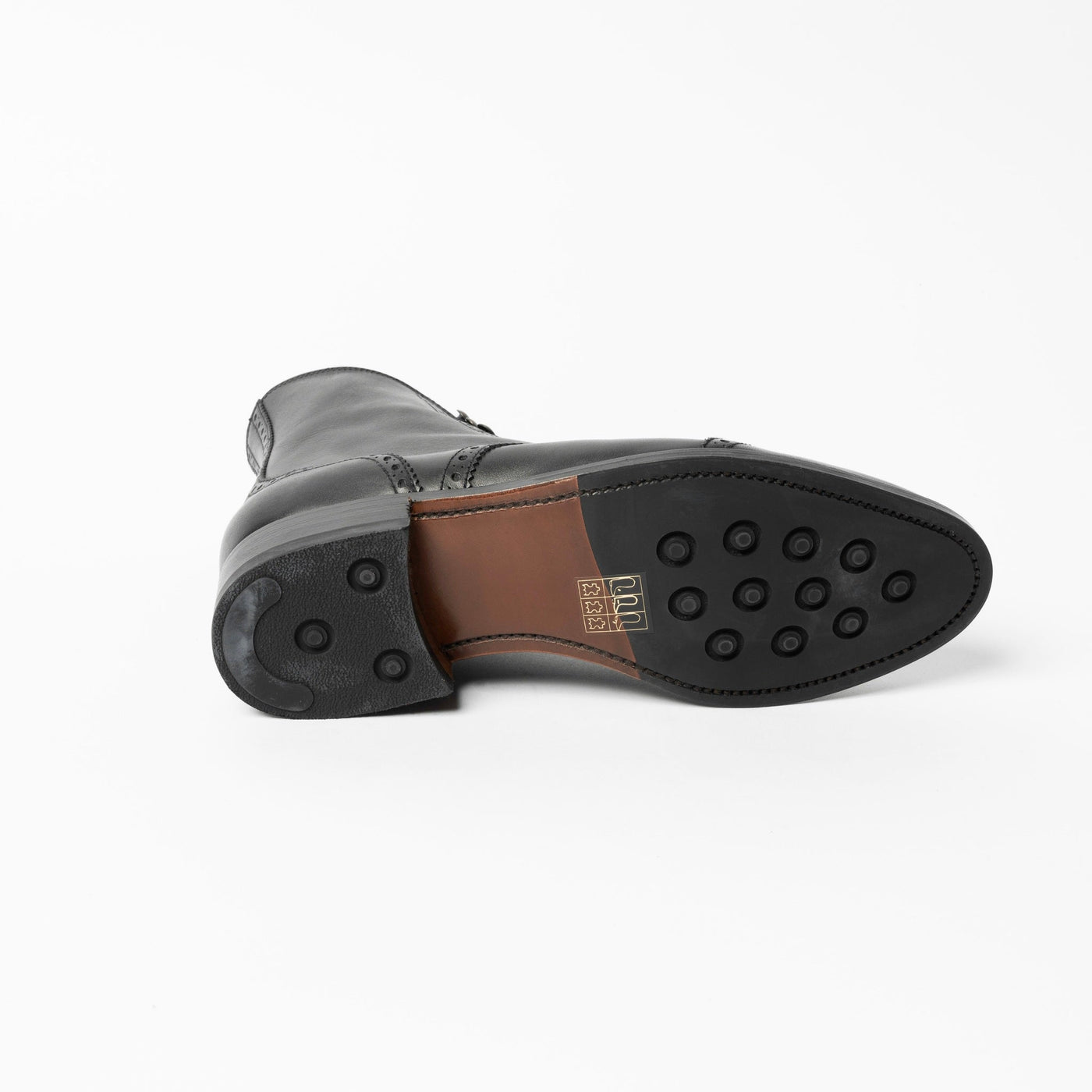 Women's good year welted boots in black leather. 
