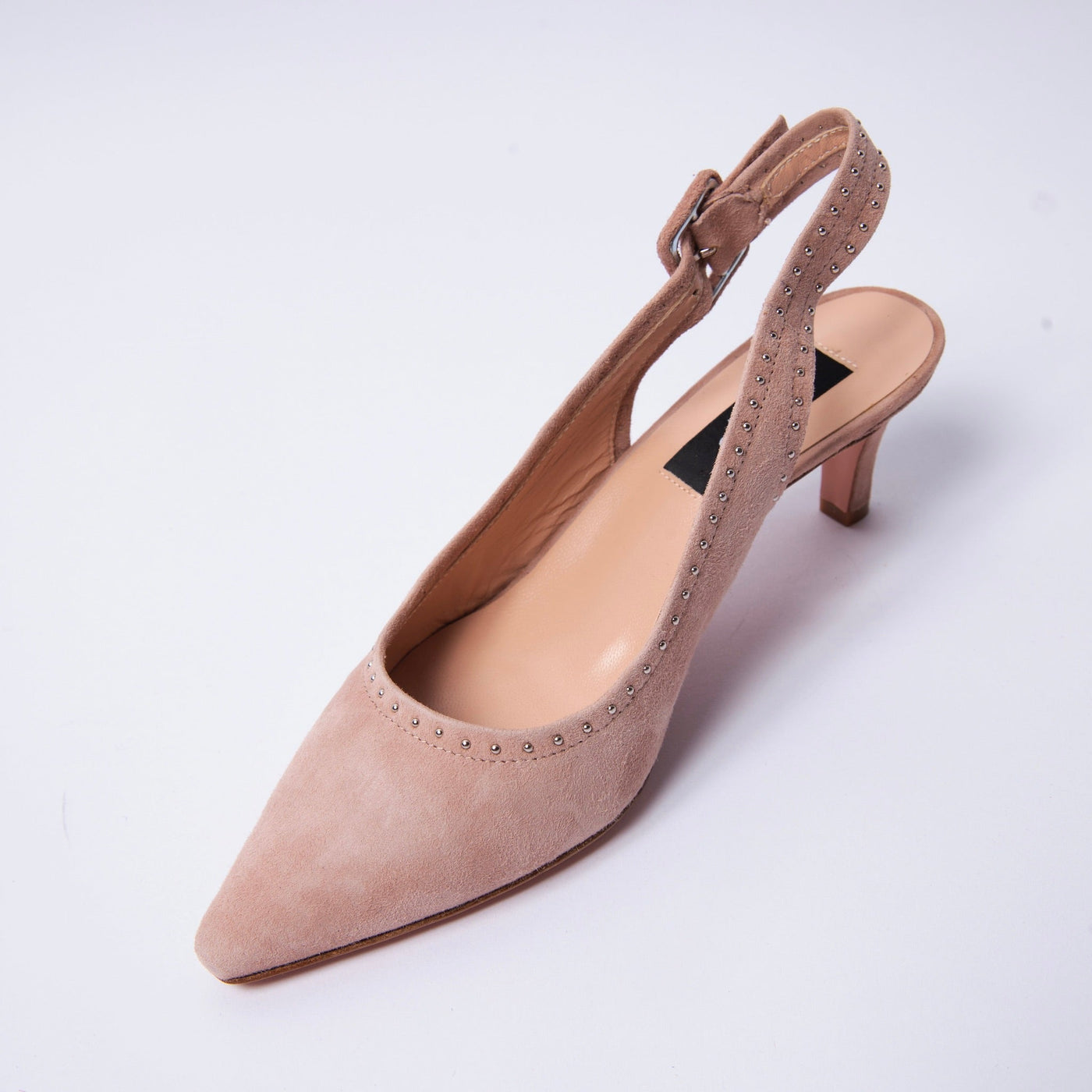 Nude suede slingback sandals with decorative silver studs.