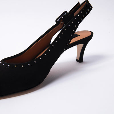 Black suede slingback sandals with decorative silver studs.