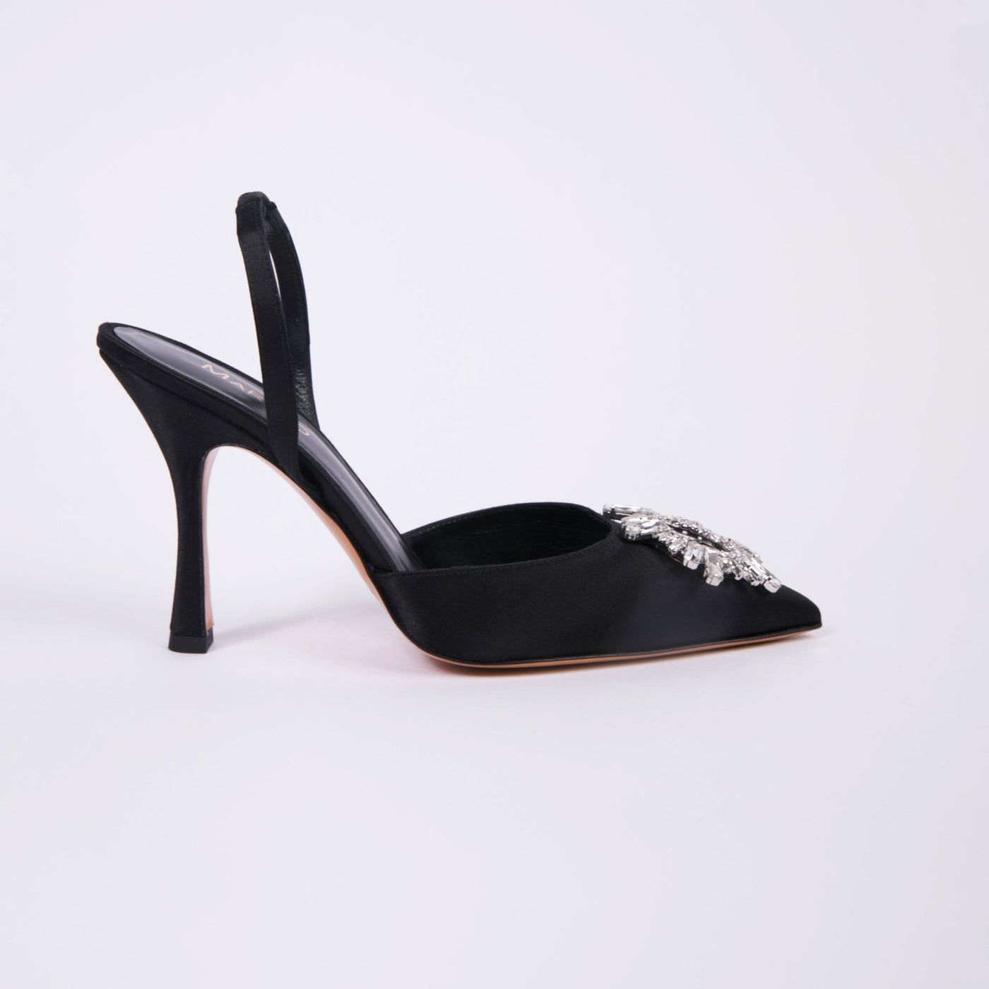 Black satin slingback pumps with round crystal buckle. 