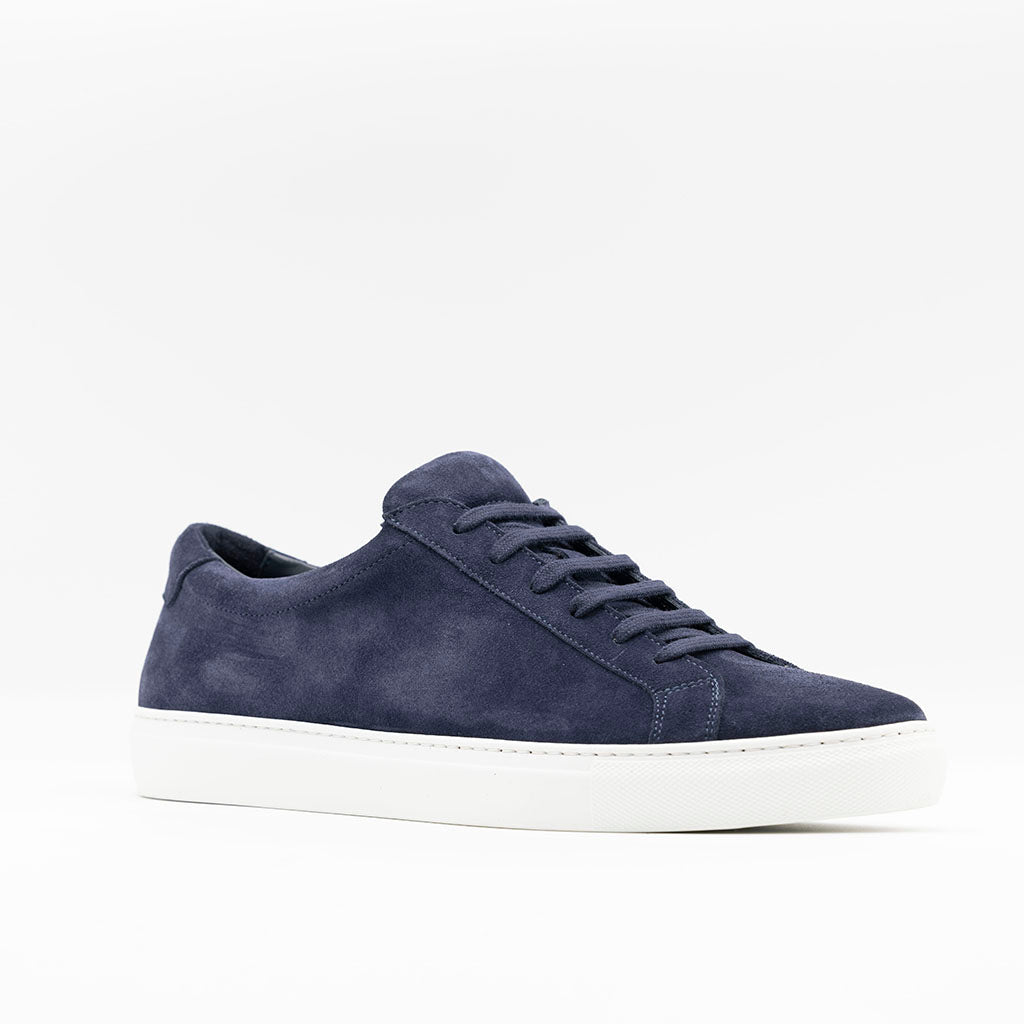 Mens classic sneaker in navy suede with white rubber sole. 