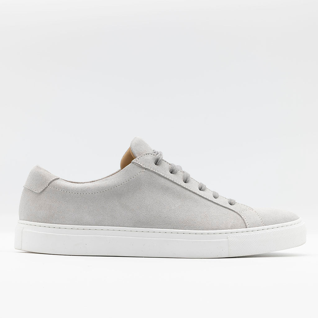 Classic sneaker light grey set on rubber soles. 