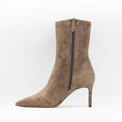 Beige suede ankle boots with stiletto heels. 