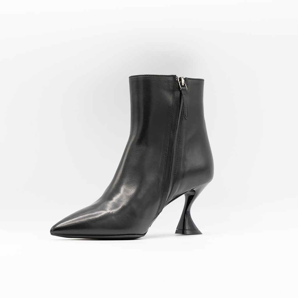 Black leather ankle boots with curved heel. 
