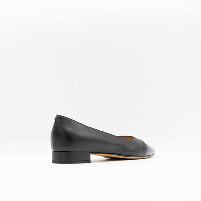Black leather flats with contrasting toe. 