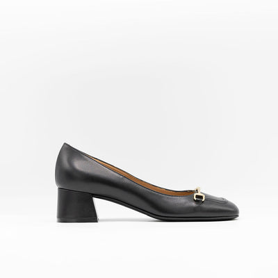 Heeled pump made from smooth black calf leather, featuring a square-shaped toe with a gold metallic horse-bit buckle