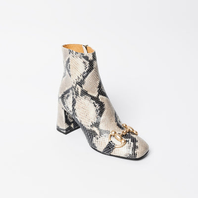 Snake printed ankle boots with horsebit. 