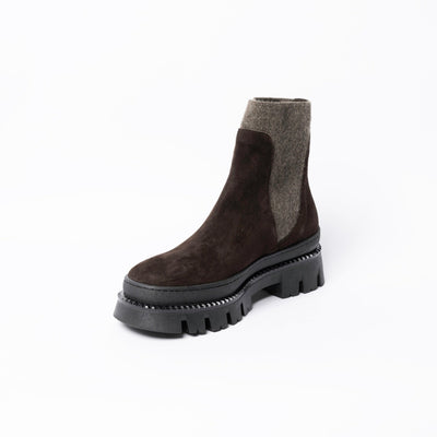Ankle boots in brown suede with chunky rubber soles. .