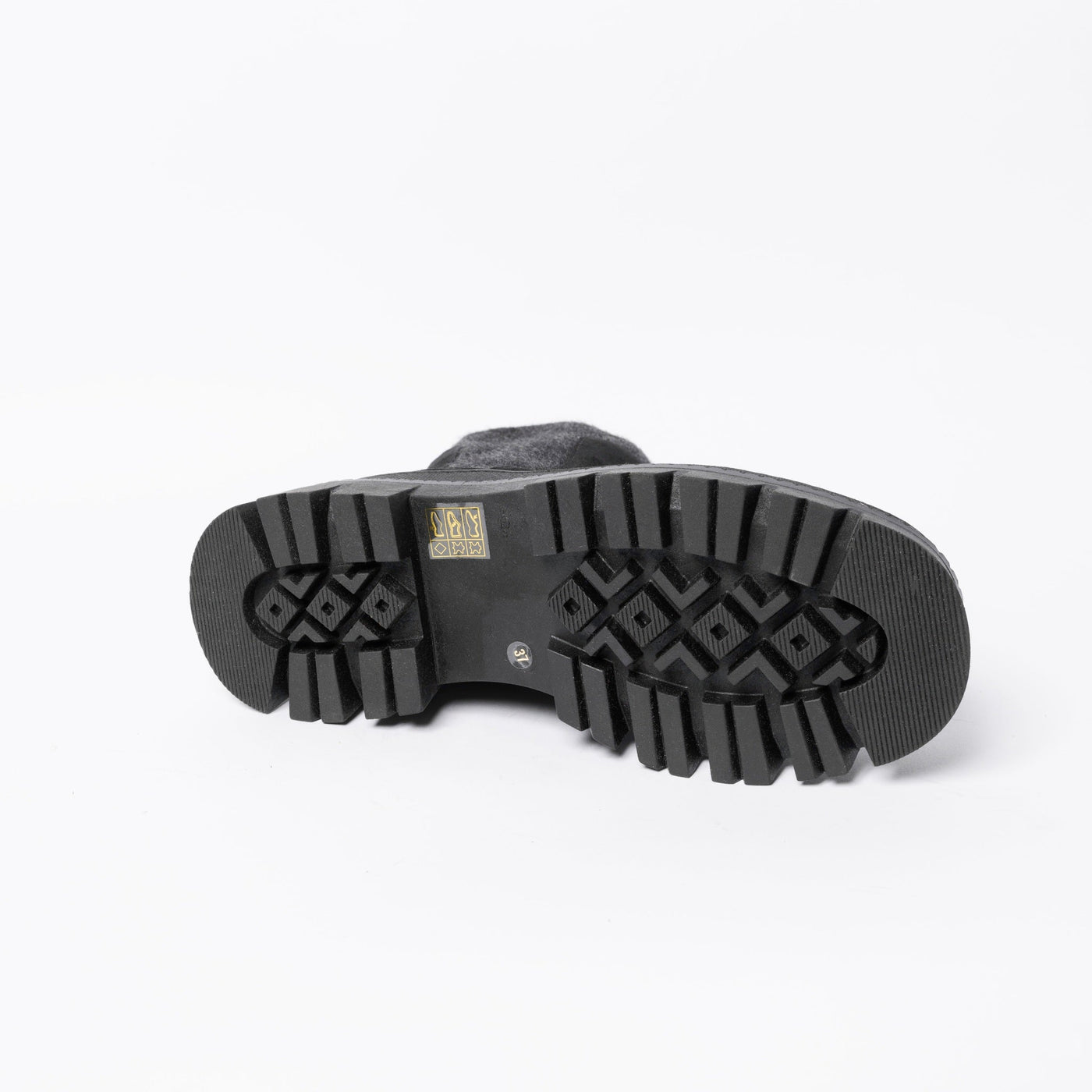Ankle boots in black suede with chunky rubber soles. .