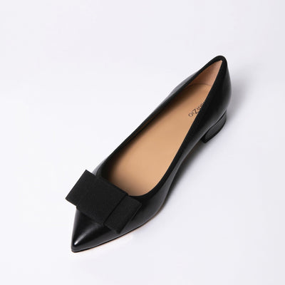 Black leather ballet flats with grosgrain bow. 