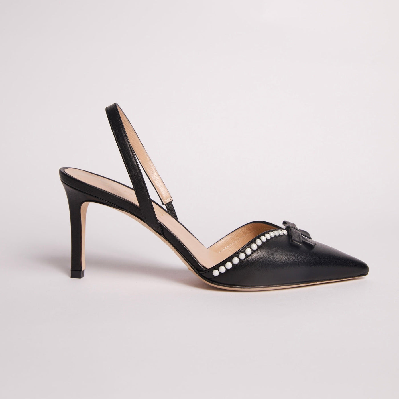 Black slingback pump with beading details.