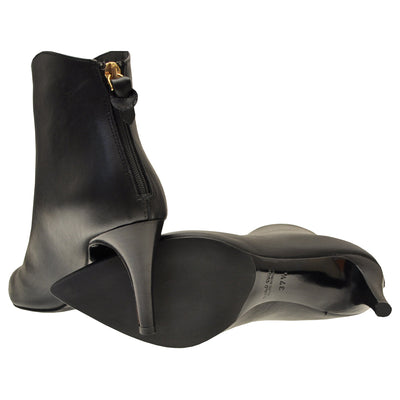 Pointed ankle boots with stiletto heels and rubber soles. 
