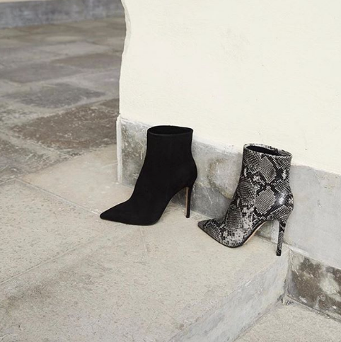Black suede boots with stiletto heel.