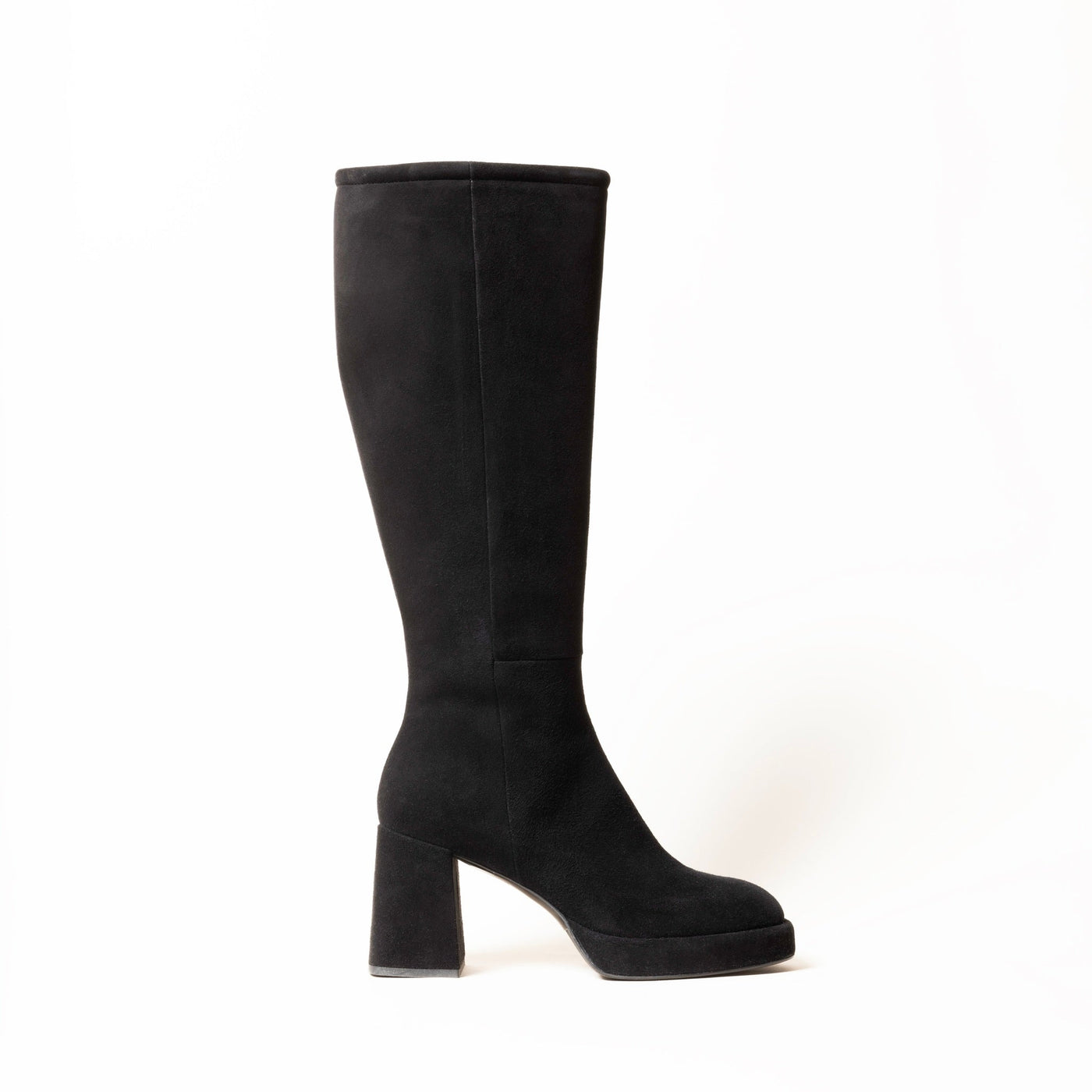Black platform heeled knee high boots.